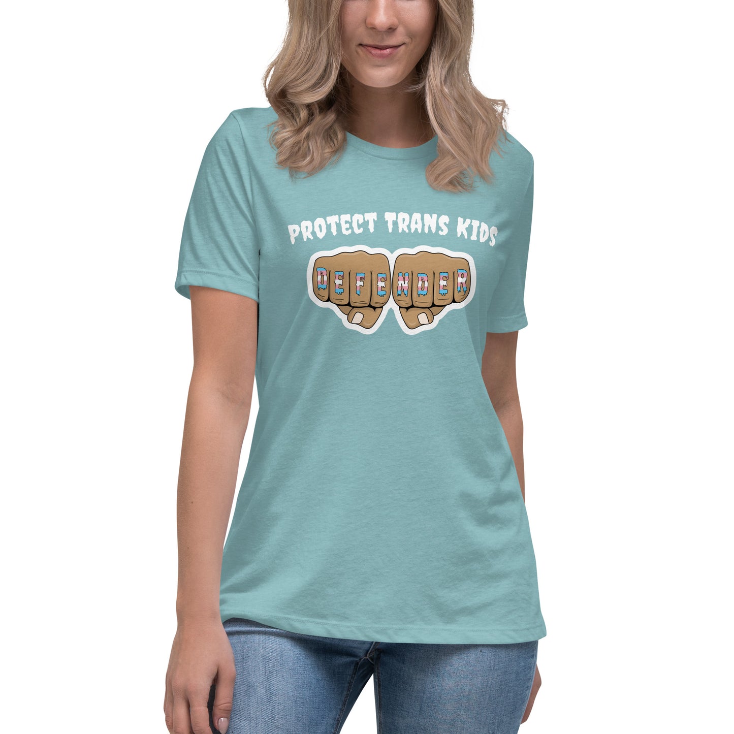 A standard, round neck, short sleeve t-shirt in light teal with the text "protect trans kids" in white lettering above an image of fists with "defender" written across the knuckles in blue,pink, and white. The shirt is on a white, straight sized model standing against a white background.