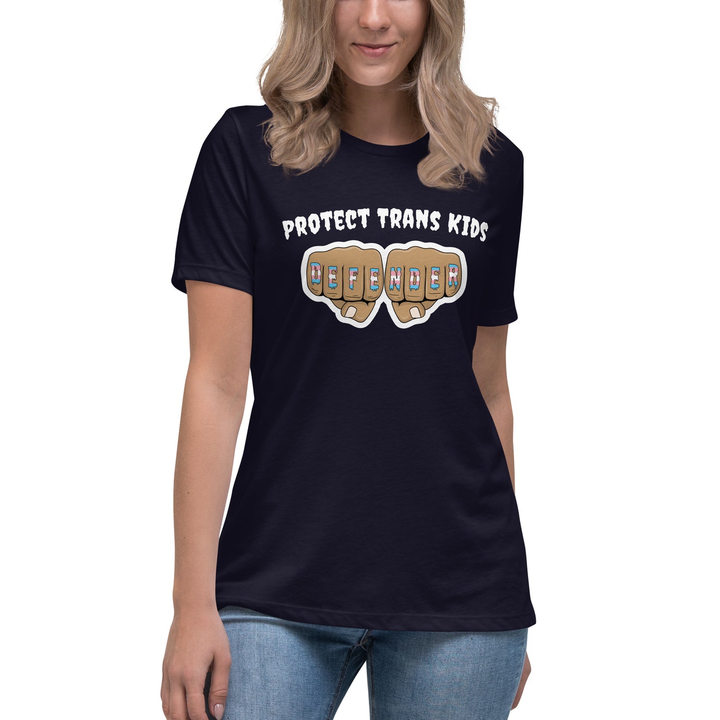 A standard, round neck, short sleeve t-shirt in black with the text "protect trans kids" in white lettering above an image of fists with "defender" written across the knuckles in blue,pink, and white. The shirt is on a white, straight sized model standing against a white background.