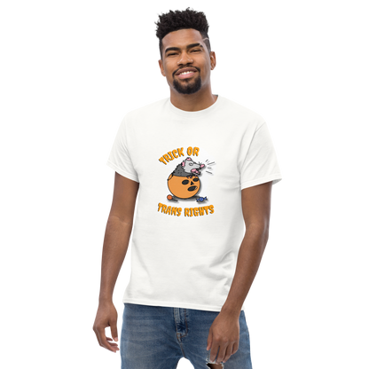 This design features a possum in an orange plastic candy bucket with the text "Trick or Transphobia"  on a white t-shirt. This image is the shirt design on a standard sized model.