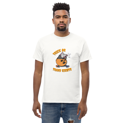 This design features a possum in an orange plastic candy bucket with the text "Trick or Transphobia"  on a white t-shirt. This image is the shirt design on a standard sized model.