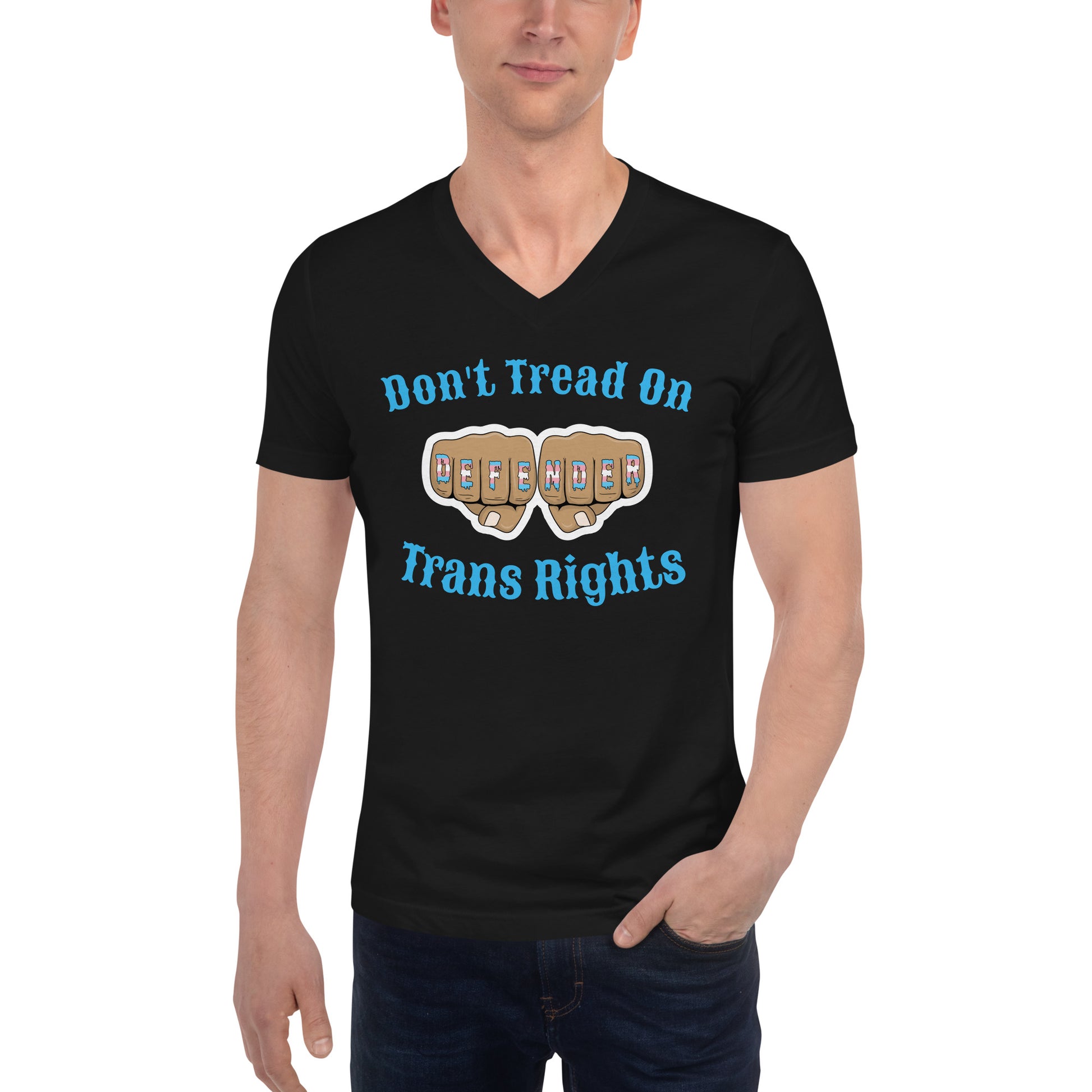 A v-neck, short sleeve t-shirt in black with the text "Don't Tread on Trans Rights" in blue lettering circling an image of fists with "defender" written across the knuckles in blue, pink, and white. The shirt is on a white, straight sized model standing against a white background.